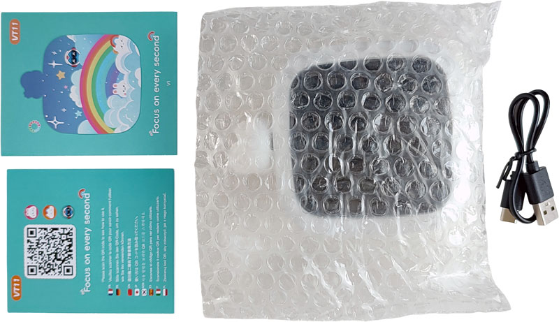 Minuteur dans sa pochette à bulles, câble et notices